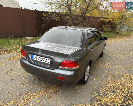 Сірий Міцубісі Lancer, об'ємом двигуна 1.58 л та пробігом 247 тис. км за 4900 $, фото 11 на Automoto.ua