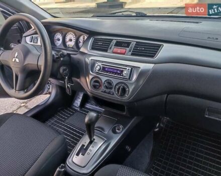 Сірий Міцубісі Lancer, об'ємом двигуна 1.58 л та пробігом 122 тис. км за 6300 $, фото 35 на Automoto.ua