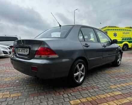 Серый Мицубиси Лансер, объемом двигателя 1.6 л и пробегом 213 тыс. км за 2400 $, фото 1 на Automoto.ua