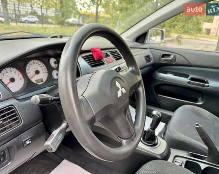 Сірий Міцубісі Lancer, об'ємом двигуна 1.58 л та пробігом 138 тис. км за 4990 $, фото 25 на Automoto.ua