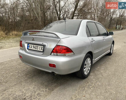 Серый Мицубиси Лансер, объемом двигателя 1.58 л и пробегом 240 тыс. км за 5500 $, фото 2 на Automoto.ua