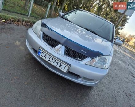 Сірий Міцубісі Lancer, об'ємом двигуна 1.58 л та пробігом 235 тис. км за 5200 $, фото 8 на Automoto.ua