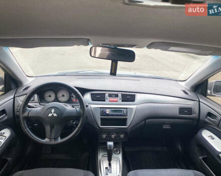 Серый Мицубиси Лансер, объемом двигателя 1.58 л и пробегом 240 тыс. км за 5500 $, фото 7 на Automoto.ua