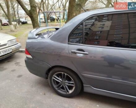 Сірий Міцубісі Lancer, об'ємом двигуна 1.58 л та пробігом 250 тис. км за 4750 $, фото 3 на Automoto.ua