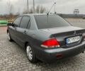 Сірий Міцубісі Lancer, об'ємом двигуна 1.6 л та пробігом 253 тис. км за 3100 $, фото 1 на Automoto.ua