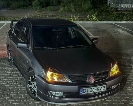 Серый Мицубиси Лансер, объемом двигателя 1.6 л и пробегом 280 тыс. км за 4000 $, фото 5 на Automoto.ua