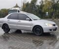 Серый Мицубиси Лансер, объемом двигателя 1.6 л и пробегом 300 тыс. км за 3250 $, фото 5 на Automoto.ua