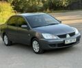 Серый Мицубиси Лансер, объемом двигателя 1.6 л и пробегом 129 тыс. км за 3448 $, фото 1 на Automoto.ua