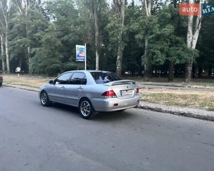 Серый Мицубиси Лансер, объемом двигателя 1.6 л и пробегом 300 тыс. км за 3799 $, фото 7 на Automoto.ua