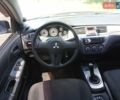 Серый Мицубиси Лансер, объемом двигателя 1.6 л и пробегом 188 тыс. км за 4999 $, фото 7 на Automoto.ua