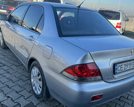 Серый Мицубиси Лансер, объемом двигателя 1.58 л и пробегом 178 тыс. км за 3300 $, фото 11 на Automoto.ua