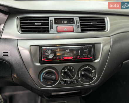 Сірий Міцубісі Lancer, об'ємом двигуна 1.58 л та пробігом 247 тис. км за 4900 $, фото 20 на Automoto.ua