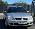 Сірий Міцубісі Lancer, об'ємом двигуна 1.6 л та пробігом 460 тис. км за 3350 $, фото 1 на Automoto.ua