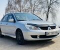 Серый Мицубиси Лансер, объемом двигателя 1.6 л и пробегом 369 тыс. км за 2600 $, фото 1 на Automoto.ua