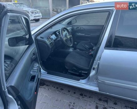 Серый Мицубиси Лансер, объемом двигателя 1.6 л и пробегом 256 тыс. км за 4500 $, фото 3 на Automoto.ua