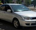 Серый Мицубиси Лансер, объемом двигателя 1.6 л и пробегом 145 тыс. км за 5000 $, фото 1 на Automoto.ua