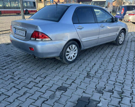 Серый Мицубиси Лансер, объемом двигателя 1.58 л и пробегом 178 тыс. км за 3300 $, фото 12 на Automoto.ua