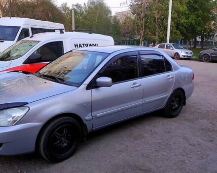 Серый Мицубиси Лансер, объемом двигателя 1.6 л и пробегом 302 тыс. км за 3200 $, фото 2 на Automoto.ua