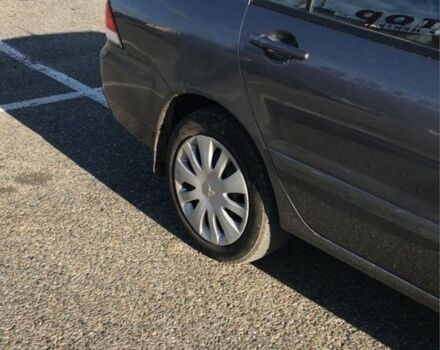 Серый Мицубиси Лансер, объемом двигателя 1.5 л и пробегом 269 тыс. км за 4200 $, фото 2 на Automoto.ua