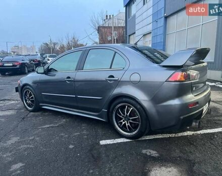 Серый Мицубиси Лансер, объемом двигателя 2 л и пробегом 170 тыс. км за 6999 $, фото 5 на Automoto.ua