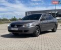 Серый Мицубиси Лансер, объемом двигателя 1.6 л и пробегом 325 тыс. км за 3200 $, фото 1 на Automoto.ua