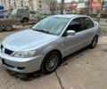 Серый Мицубиси Лансер, объемом двигателя 1.58 л и пробегом 160 тыс. км за 5200 $, фото 1 на Automoto.ua
