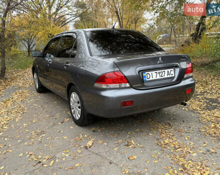 Сірий Міцубісі Lancer, об'ємом двигуна 1.58 л та пробігом 247 тис. км за 4900 $, фото 7 на Automoto.ua