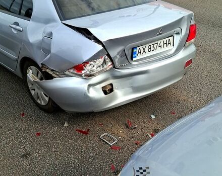 Серый Мицубиси Лансер, объемом двигателя 1.6 л и пробегом 260 тыс. км за 2700 $, фото 1 на Automoto.ua