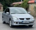 Серый Мицубиси Лансер, объемом двигателя 1.58 л и пробегом 241 тыс. км за 3750 $, фото 2 на Automoto.ua