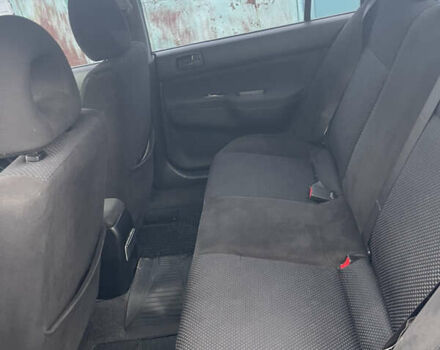 Серый Мицубиси Лансер, объемом двигателя 1.58 л и пробегом 205 тыс. км за 4750 $, фото 7 на Automoto.ua