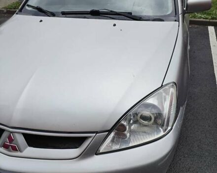 Серый Мицубиси Лансер, объемом двигателя 1.6 л и пробегом 210 тыс. км за 3500 $, фото 2 на Automoto.ua