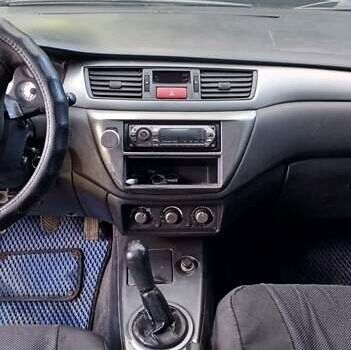 Серый Мицубиси Лансер, объемом двигателя 1.58 л и пробегом 300 тыс. км за 4400 $, фото 7 на Automoto.ua