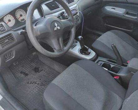 Серый Мицубиси Лансер, объемом двигателя 1.6 л и пробегом 187 тыс. км за 4500 $, фото 9 на Automoto.ua