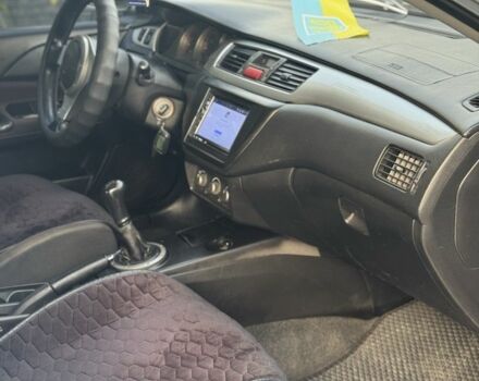 Серый Мицубиси Лансер, объемом двигателя 2 л и пробегом 185 тыс. км за 4600 $, фото 8 на Automoto.ua