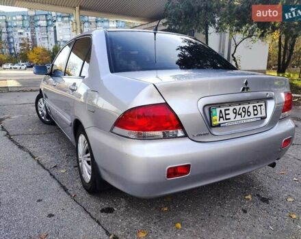 Сірий Міцубісі Lancer, об'ємом двигуна 1.58 л та пробігом 122 тис. км за 6300 $, фото 3 на Automoto.ua