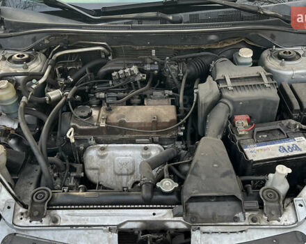 Серый Мицубиси Лансер, объемом двигателя 1.58 л и пробегом 290 тыс. км за 3750 $, фото 11 на Automoto.ua