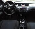 Сірий Міцубісі Lancer, об'ємом двигуна 1 л та пробігом 400 тис. км за 2850 $, фото 7 на Automoto.ua