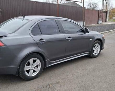 Серый Мицубиси Лансер, объемом двигателя 2 л и пробегом 189 тыс. км за 6800 $, фото 1 на Automoto.ua