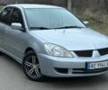 Серый Мицубиси Лансер, объемом двигателя 1.6 л и пробегом 226 тыс. км за 3300 $, фото 1 на Automoto.ua
