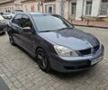 Серый Мицубиси Лансер, объемом двигателя 1.58 л и пробегом 260 тыс. км за 3700 $, фото 1 на Automoto.ua