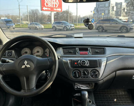 Сірий Міцубісі Lancer, об'ємом двигуна 1.6 л та пробігом 249 тис. км за 5100 $, фото 7 на Automoto.ua
