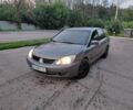Серый Мицубиси Лансер, объемом двигателя 1.6 л и пробегом 320 тыс. км за 2999 $, фото 1 на Automoto.ua