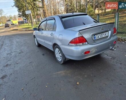 Сірий Міцубісі Lancer, об'ємом двигуна 1.58 л та пробігом 235 тис. км за 5200 $, фото 9 на Automoto.ua
