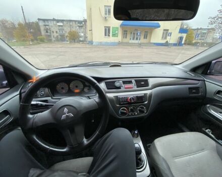 Серый Мицубиси Лансер, объемом двигателя 1.6 л и пробегом 380 тыс. км за 4000 $, фото 9 на Automoto.ua