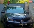 Серый Мицубиси Лансер, объемом двигателя 1.6 л и пробегом 305 тыс. км за 4000 $, фото 1 на Automoto.ua