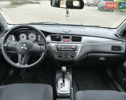 Серый Мицубиси Лансер, объемом двигателя 1.6 л и пробегом 116 тыс. км за 4999 $, фото 25 на Automoto.ua