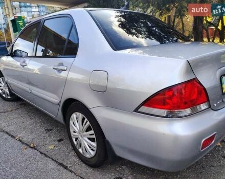 Сірий Міцубісі Lancer, об'ємом двигуна 1.58 л та пробігом 122 тис. км за 6300 $, фото 25 на Automoto.ua