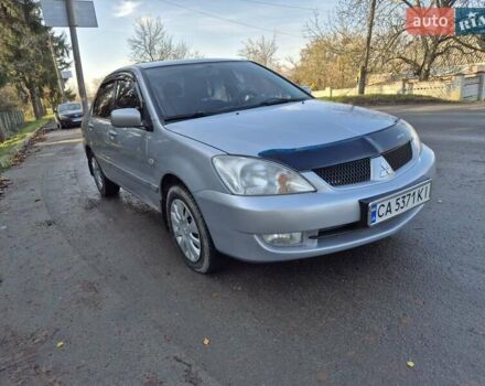 Сірий Міцубісі Lancer, об'ємом двигуна 1.58 л та пробігом 235 тис. км за 5200 $, фото 7 на Automoto.ua