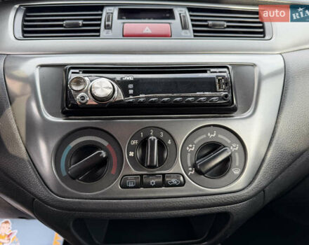 Серый Мицубиси Лансер, объемом двигателя 1.3 л и пробегом 160 тыс. км за 5555 $, фото 46 на Automoto.ua