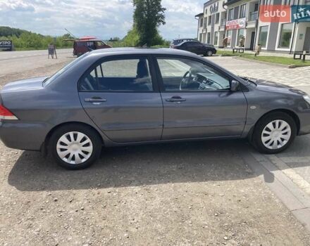 Сірий Міцубісі Lancer, об'ємом двигуна 1.59 л та пробігом 44 тис. км за 6200 $, фото 6 на Automoto.ua